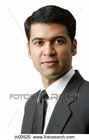 Stock Image - Businessman looking at camera, portrait. Fotosearch