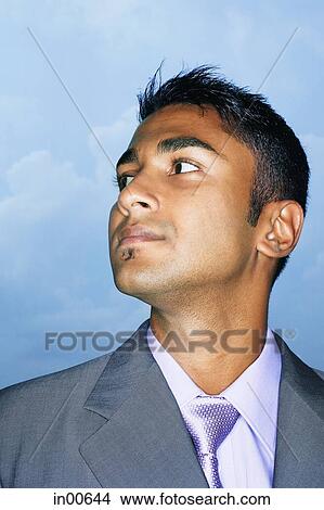 Businessman looking away, head shot View Large Photo Image Picture - Businessman looking away, head shot. Fotosearch