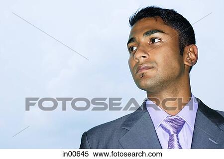 Stock Photography - Businessman looking away, portrait. Fotosearch