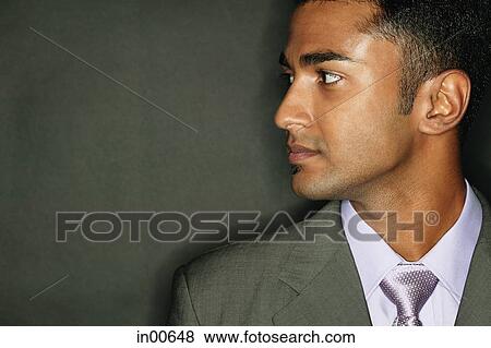 Businessman looking away, side view View Large Photo Image Stock Photo - Businessman looking away, side view. Fotosearch