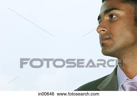 Businessman looking away, side view View Large Photo Image Stock Photograph - Businessman looking away, side view. Fotosearch