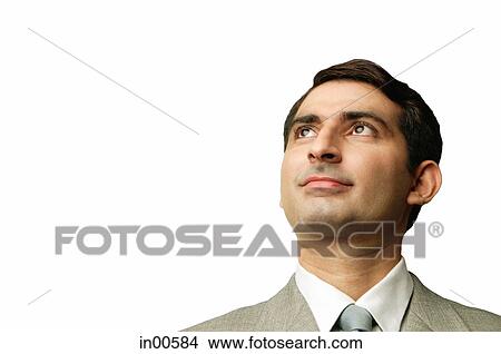 Picture - Businessman, looking up, head shot. Fotosearch