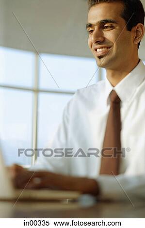 Businessman using laptop View Large Photo Image Stock Photography - Businessman using laptop. Fotosearch