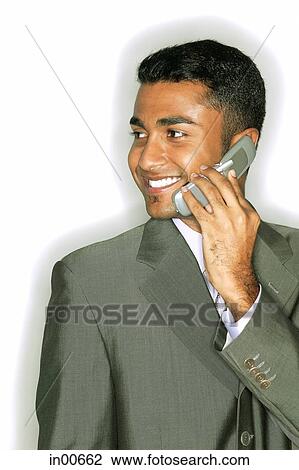 Businessman using mobile phone View Large Photo Image Stock Image - Businessman using mobile phone. Fotosearch