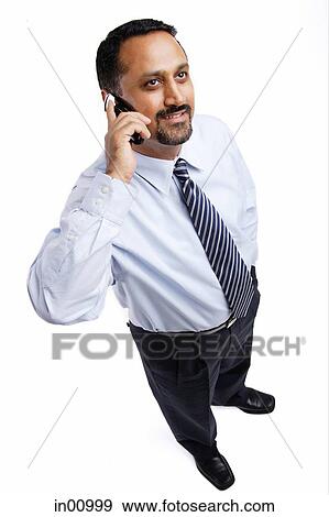 Stock Photo - Businessman using mobile phone. Fotosearch