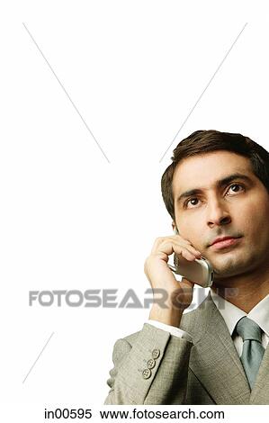 Stock Photography - Businessman using mobile phone. Fotosearch