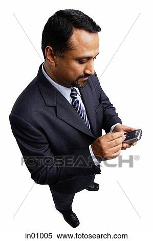 Businessman using PDA View Large Photo Image Stock Photography - Businessman using PDA. Fotosearch