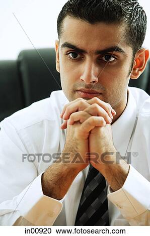 Businessman with hands clasped View Large Photo Image Stock Image - Businessman with hands clasped. Fotosearch