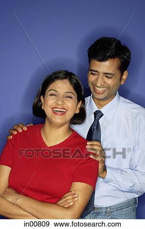 Couple laughing, facing camera View Large Photo Image Stock Photo - Couple laughing, facing camera. Fotosearch