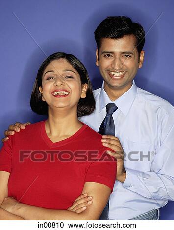 Couple looking at camera, portrait View Large Photo Image Stock Image - Couple looking at camera, portrait. Fotosearch