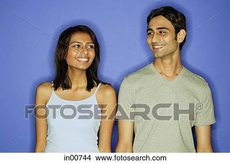 Picture - Couple standing side by side. Fotosearch