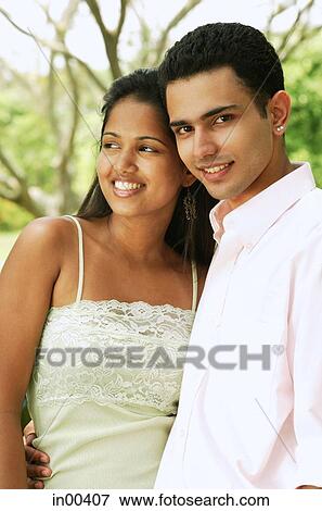 Couple standing side by side, portrait View Large Photo Image Stock Photo - Couple standing side by side, portrait. Fotosearch