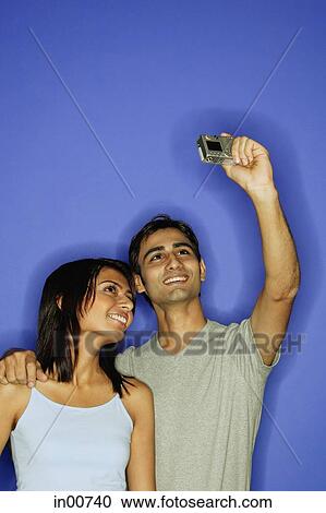 Couple taking a picture of themselves View Large Photo Image Stock Image - Couple taking a picture of themselves. Fotosearch