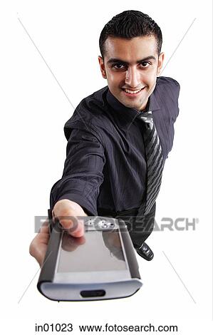 Executive holding PDA towards camera View Large Photo Image Stock Image - Executive holding PDA towards camera. Fotosearch