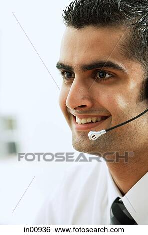 Executive using headset, head shot View Large Photo Image Stock Photograph - Executive using headset, head shot. Fotosearch