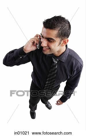 Executive using mobile phone, high angle view View Large Photo Image Stock Image - Executive using mobile phone, high angle view. Fotosearch