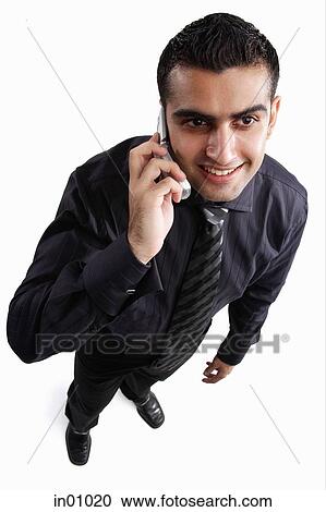 Stock Image - Executive using mobile phone. Fotosearch