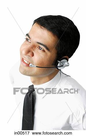 Executive wearing headset, looking away View Large Photo Image Stock Photo - Executive wearing headset, looking away. Fotosearch