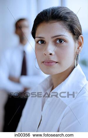 Female executive looking at camera View Large Photo Image Stock Photograph - Female executive looking at camera. Fotosearch