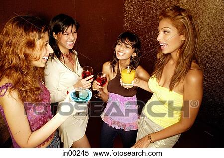 Four women with drinks, standing and talking View Large Photo Image Stock Photography - Four women with drinks, standing and talking. Fotosearch