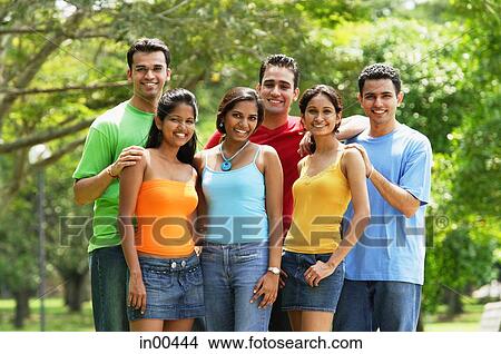 Picture - Group of young adults, smiling at camera. Fotosearch