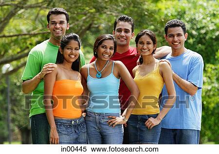 Group of young adults, smiling at camera, portrait View Large Photo Image Stock Photography - Group of young adults, smiling at camera, portrait. Fotosearch