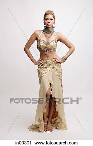 Stock Photography - Young woman in Indian costume, hands on hips. Fotosearch - Search Stock Photos, Pictures, Prints, Images, and Photo Clip Art