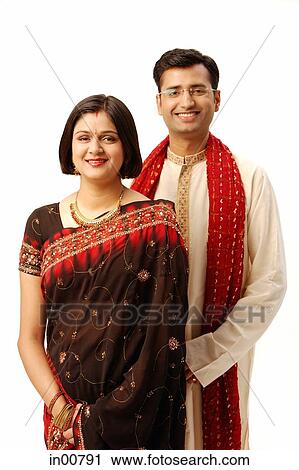 Stock Image - Indian couple in traditional clothing, portrait. Fotosearch