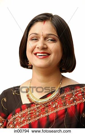 Picture - Indian woman in traditional clothing, looking at camera, head shot. Fotosearch