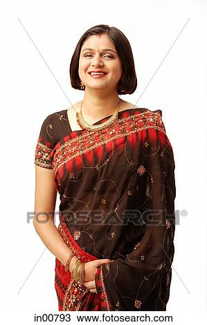 Indian woman in traditional clothing, looking at camera View Large Photo Image Stock Image - Indian woman in traditional clothing, looking at camera. Fotosearch