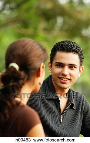 Man facing woman, over the shoulder view View Large Photo Image Stock Image - Man facing woman, over the shoulder view. Fotosearch