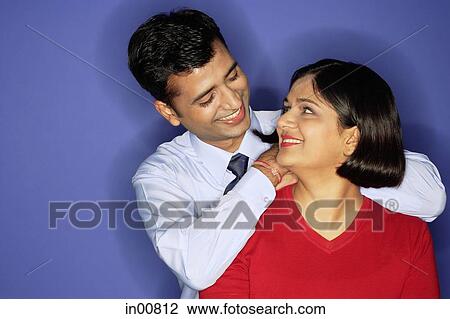 Man leaning on woman's shoulder, woman turning to look at him View Large Photo Image Stock Image - Man leaning on woman's shoulder, woman turning to look at him. Fotosearch