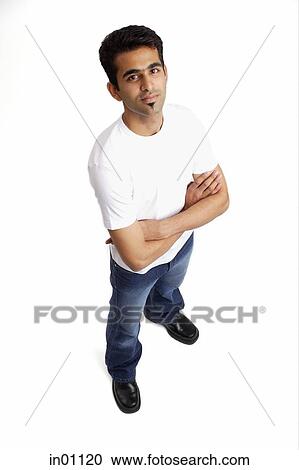Man looking at camera, arms crossed View Large Photo Image Stock Image - Man looking at camera, arms crossed. Fotosearch