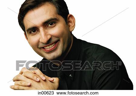 Man looking at camera, hands clasped View Large Photo Image Stock Image - Man looking at camera, hands clasped. Fotosearch