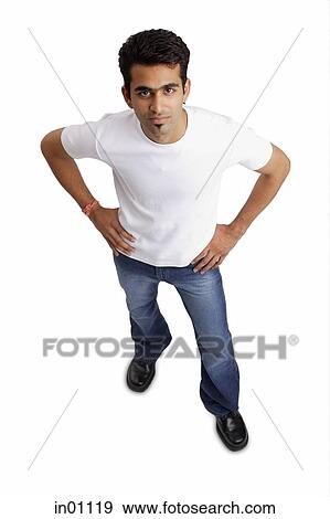 Man looking at camera, hands on hip View Large Photo Image Stock Photo - Man looking at camera, hands on hip. Fotosearch