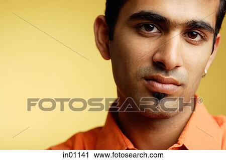 Man looking at camera, head shot View Large Photo Image Stock Image - Man looking at camera, head shot. Fotosearch