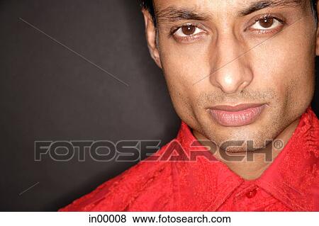 Stock Photo - Man looking at camera, head shot. Fotosearch
