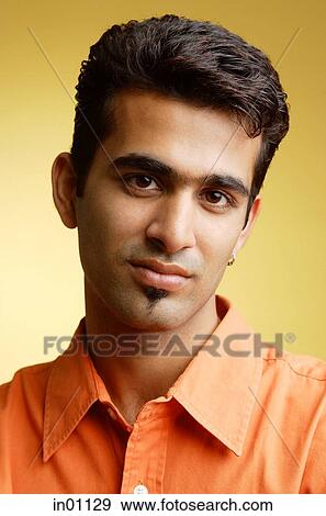 Man looking at camera, head shot View Large Photo Image Stock Photo - Man looking at camera, head shot. Fotosearch