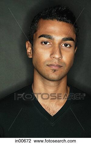 Stock Image - Man looking at camera, portrait. Fotosearch