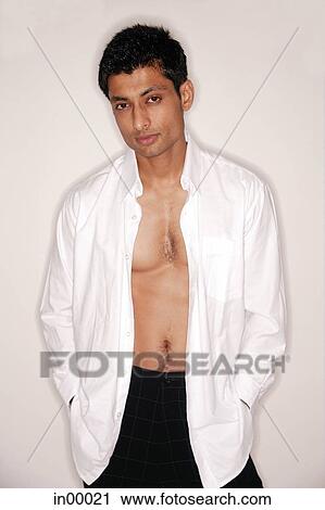 Man looking at camera, shirt fully unbuttoned View Large Photo Image Stock Image - Man looking at camera, shirt fully unbuttoned. Fotosearch