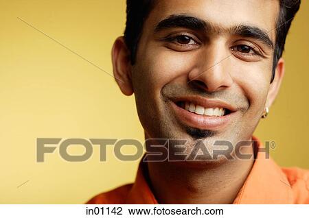 Man looking at camera, smiling, head shot View Large Photo Image Stock Image - Man looking at camera, smiling, head shot. Fotosearch
