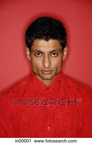 Man looking at camera, wearing red shirt View Large Photo Image Stock Image - Man looking at camera, wearing red shirt. Fotosearch