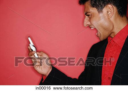 Man looking at handphone, mouth open, profile View Large Photo Image Stock Photograph - Man looking at handphone, mouth open, profile. Fotosearch