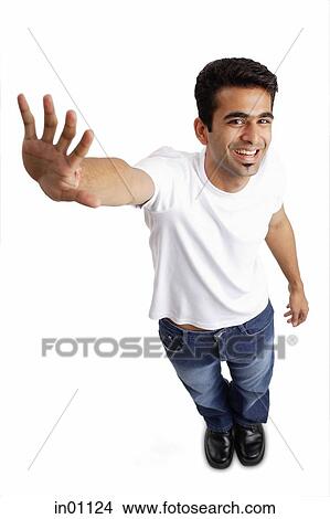 Man Smiling At Camera Arm Outstretched Showing Palm Picture In Fotosearch