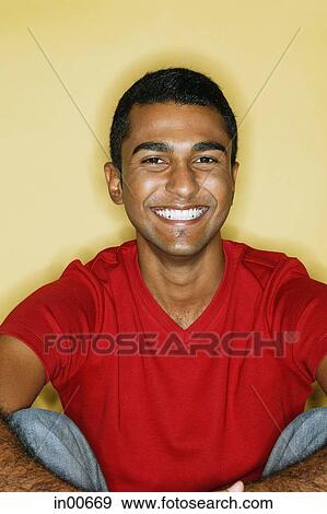 Stock Photo - Man smiling at camera, portrait. Fotosearch