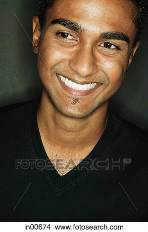 Picture - Man smiling, looking away. Fotosearch