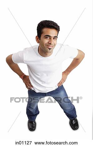 Man standing, looking at camera, hands on waist View Large Photo Image Stock Photo - Man standing, looking at camera, hands on waist. Fotosearch