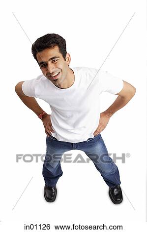 Man standing, smiling at camera, hands on waist View Large Photo Image Stock Photograph - Man standing, smiling at camera, hands on waist. Fotosearch