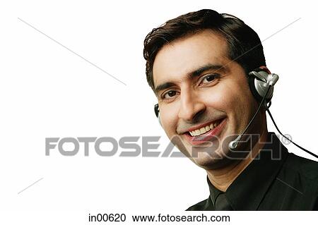 Man using headset, head shot View Large Photo Image Stock Image - Man using headset, head shot. Fotosearch