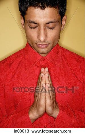 Man with eyes closed, hands up, palms together View Large Photo Image Stock Image - Man with eyes closed, hands up, palms together. Fotosearch